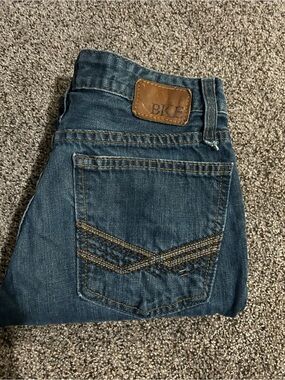 BKE Men’s Dark Blue Slim Straight Jeans with Brown Patch